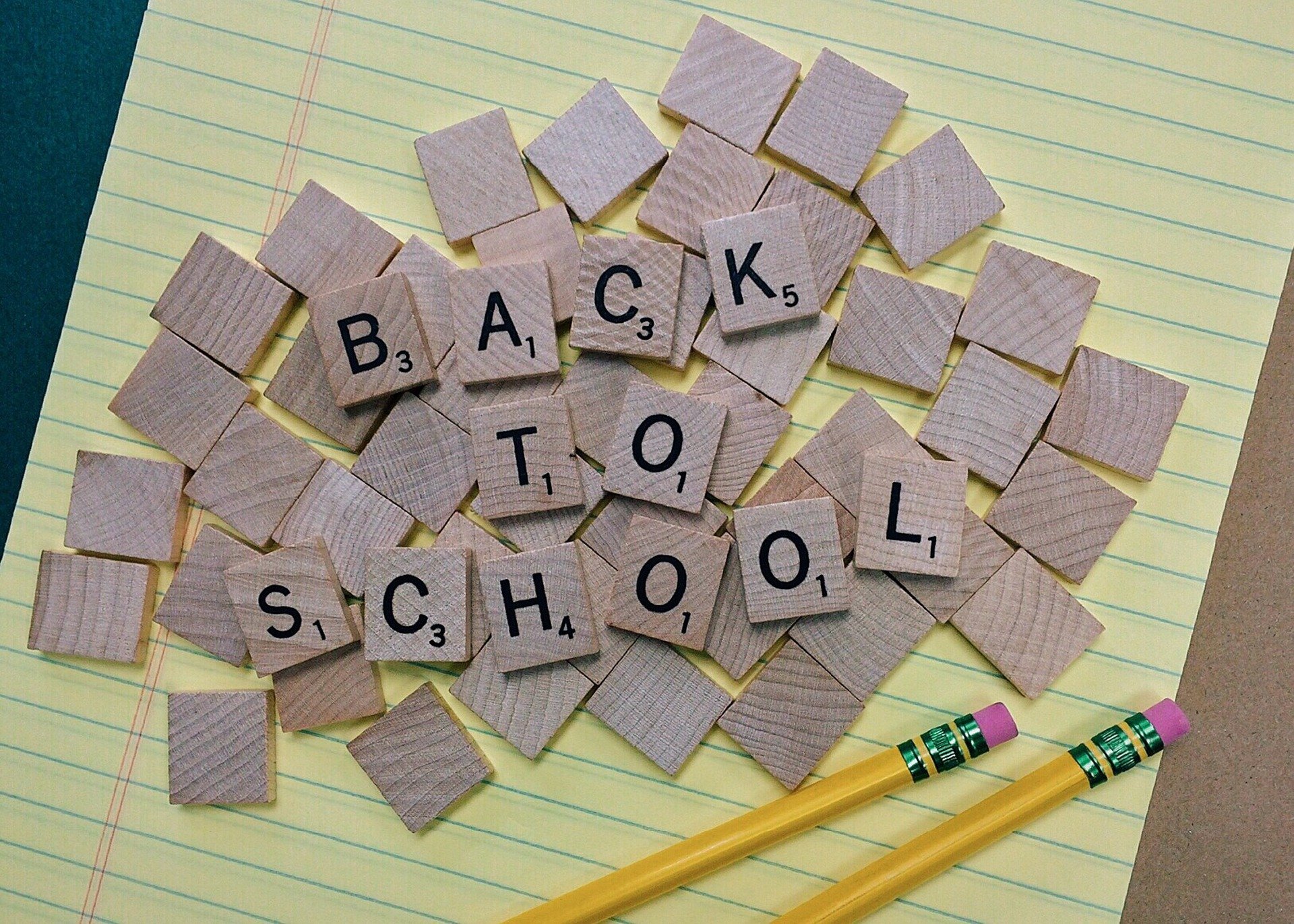 Scrabble tiles on a notepad spelling Back to School